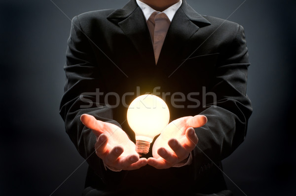 Ampoule homme pointant affaires lampe [[stock_photo]] © choreograph
