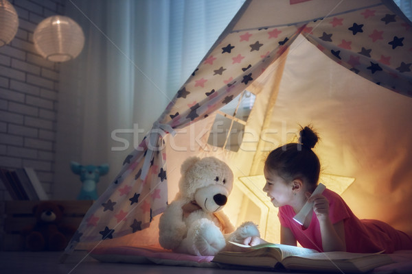 child is reading a book Stock photo © choreograph