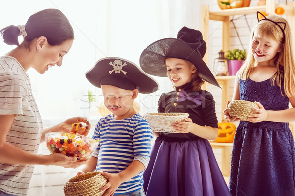 family celebrating Halloween Stock photo © choreograph