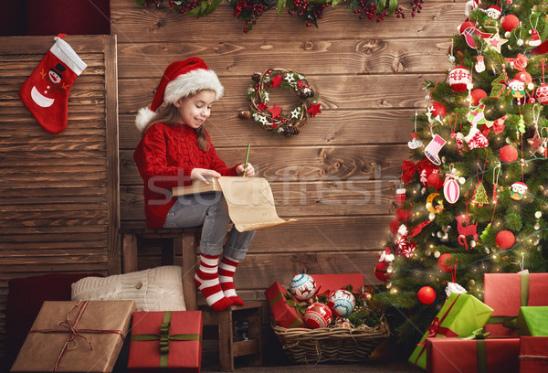 girl writes the letter to Santa Stock photo © choreograph