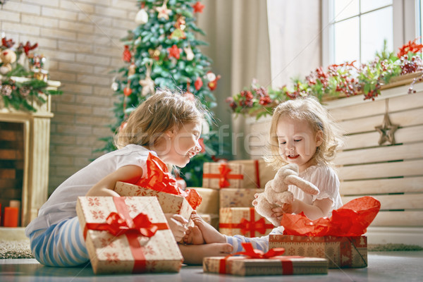 girls opening gifts Stock photo © choreograph