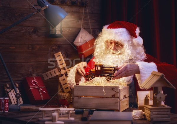 Santa Claus is preparing gifts Stock photo © choreograph