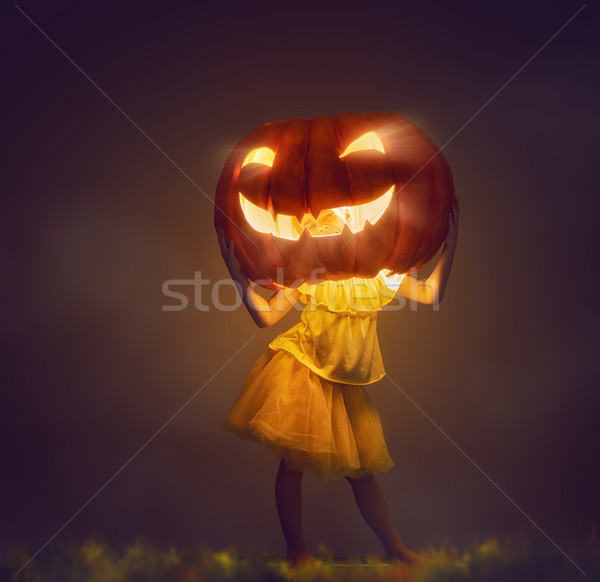 Stock photo: kid with a big pumpkin head