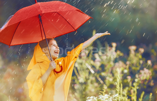 child with red umbrella Stock photo © choreograph
