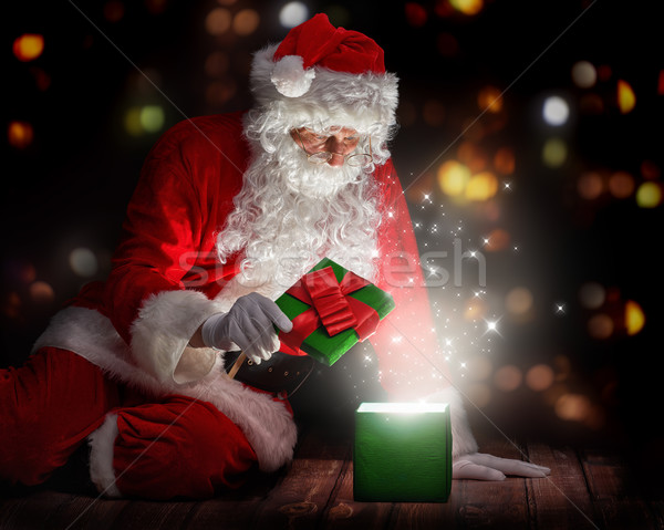Santa Claus with christmas gifts Stock photo © choreograph