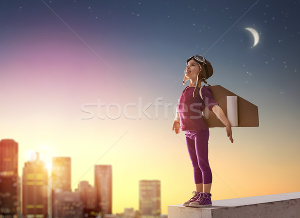 Meisje astronaut weinig kind zonsondergang hemel Stockfoto © choreograph