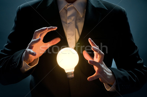 Megvilágított villanykörte férfi mutat üzlet lámpa Stock fotó © choreograph
