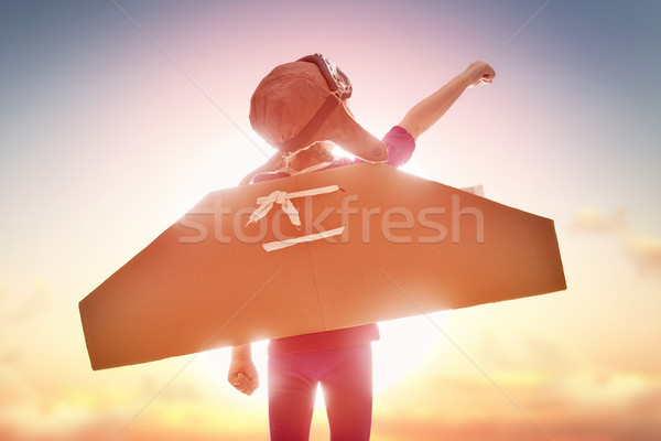 [[stock_photo]]: Fille · astronaute · peu · enfant · coucher · du · soleil · ciel