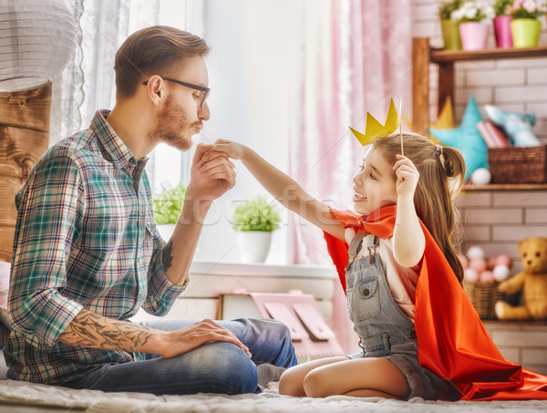 Dad kisses hand of his daughter Stock photo © choreograph