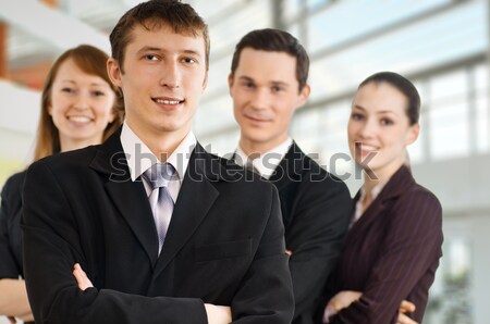 Oameni de afaceri echipă de succes zâmbitor tineri birou Imagine de stoc © choreograph