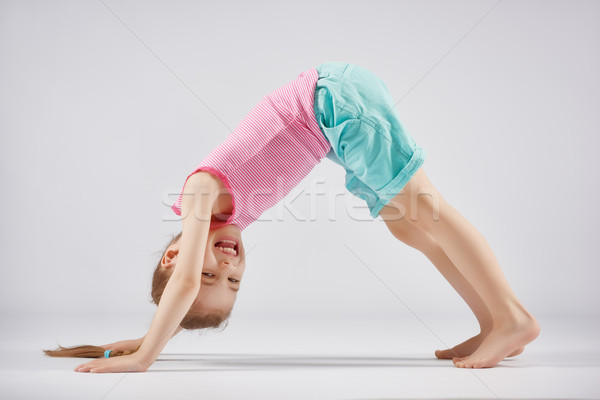 girl enjoying yoga Stock photo © choreograph