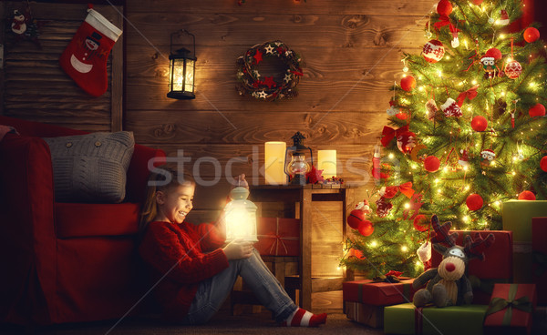 girl is decorating the Christmas tree Stock photo © choreograph