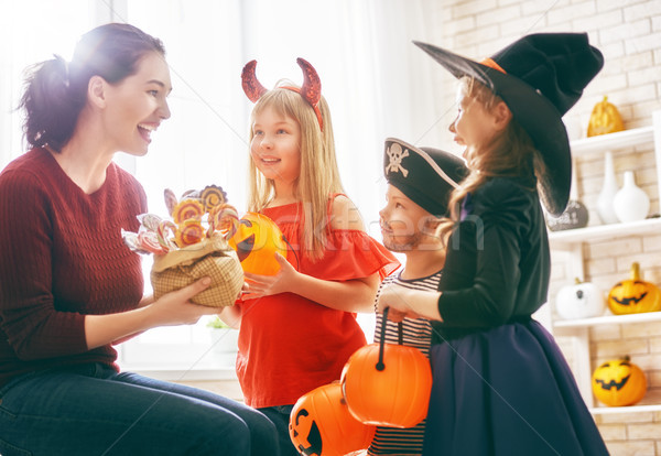 family celebrating Halloween Stock photo © choreograph