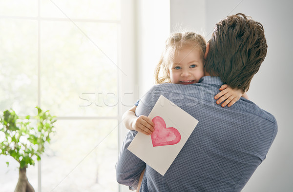 daughter congratulating dad Stock photo © choreograph