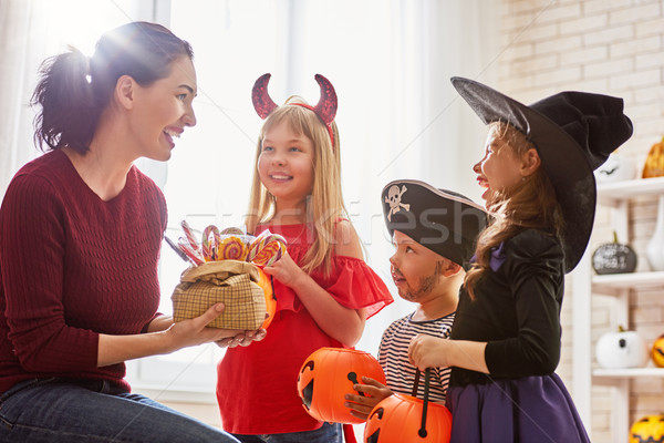 family celebrating Halloween Stock photo © choreograph
