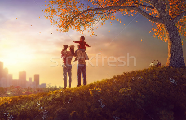 Happy family at sunset Stock photo © choreograph