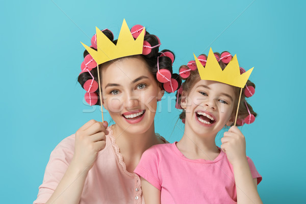 Mother and her daughter with a paper accessories Stock photo © choreograph