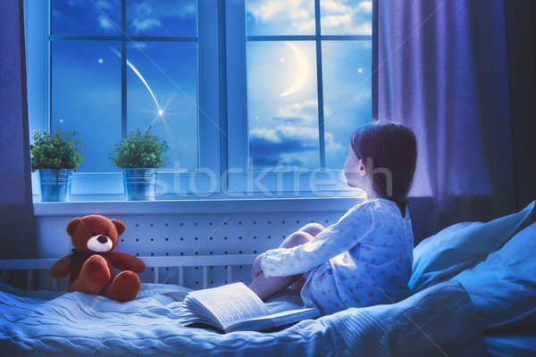 Stock photo: girl sitting at the window