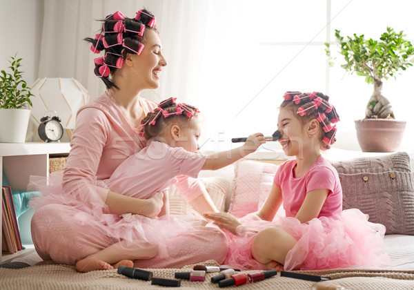 Mom and children doing makeup Stock photo © choreograph