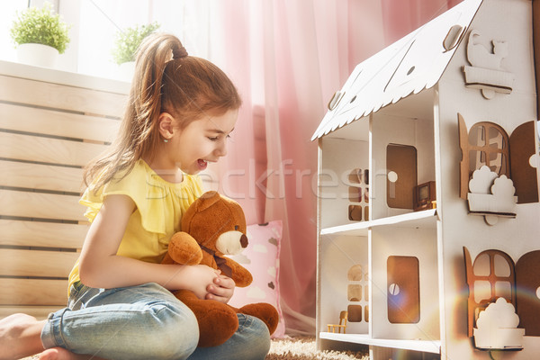 girl plays with doll house Stock photo © choreograph