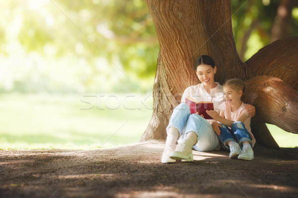 mom reading a book to her child Stock photo © choreograph