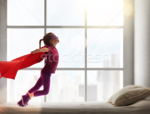 girl in an Superman's costume Stock photo © choreograph