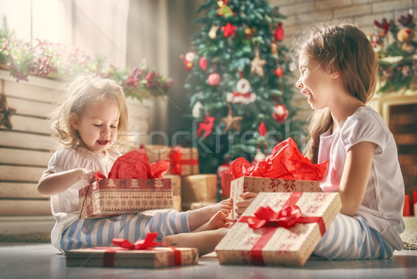 girls opening gifts Stock photo © choreograph