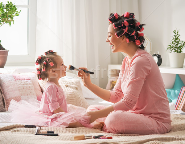 Mom and child doing hair Stock photo © choreograph