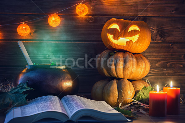 pumpkin, candles, spell book and potion Stock photo © choreograph