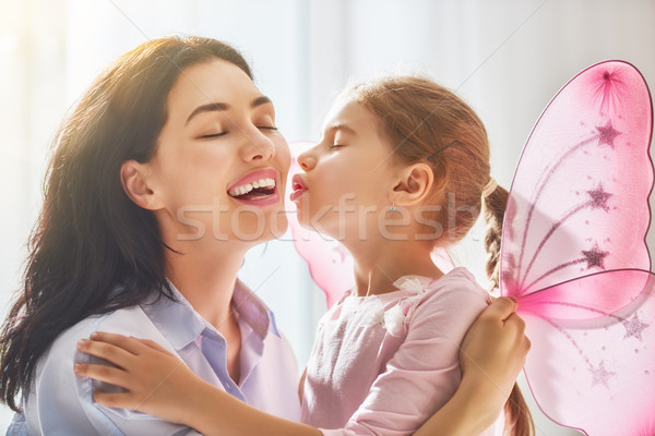 Stock photo: Mother and daughter playing and hugging