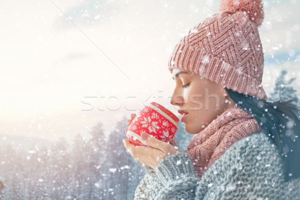 Stock photo: woman with a cup of hot tea