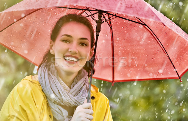 Nő piros esernyő boldog gyönyörű fiatal nő Stock fotó © choreograph