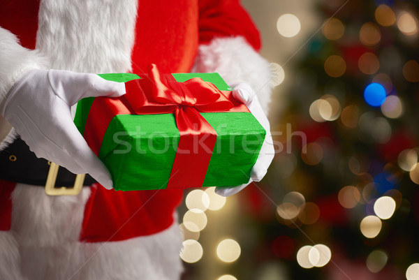 Święty mikołaj ręce christmas obecnej szczęśliwy polu Zdjęcia stock © choreograph