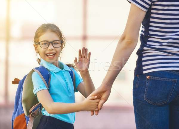 Stock photo: Parent and pupil go to school