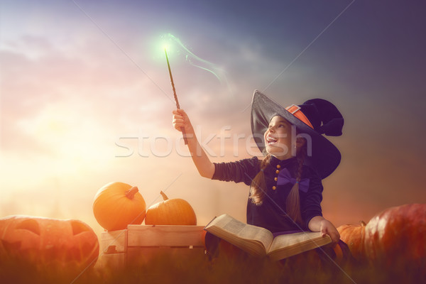 witch with pumpkins Stock photo © choreograph