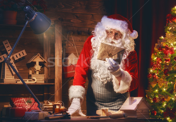Santa Clause is preparing gifts Stock photo © choreograph