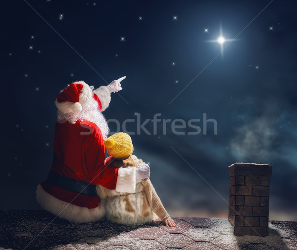 Dziewczyna Święty mikołaj posiedzenia dachu wesoły christmas Zdjęcia stock © choreograph