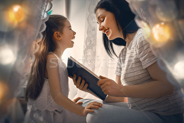 Family reading bedtime. Stock photo © choreograph