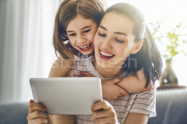 mom and child with tablet Stock photo © choreograph