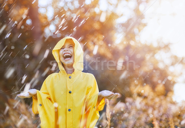 child under autumn rain Stock photo © choreograph