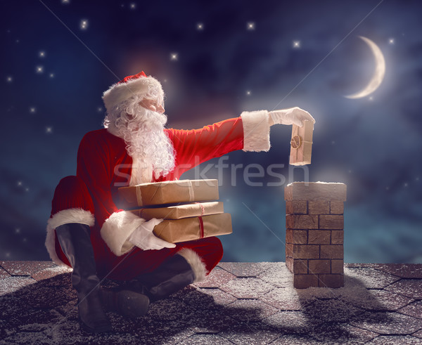 Noel baba oturma çatı neşeli Noel mutlu Stok fotoğraf © choreograph