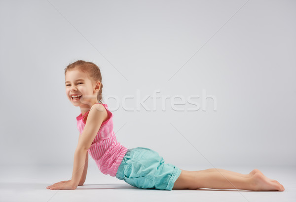 girl enjoying yoga Stock photo © choreograph