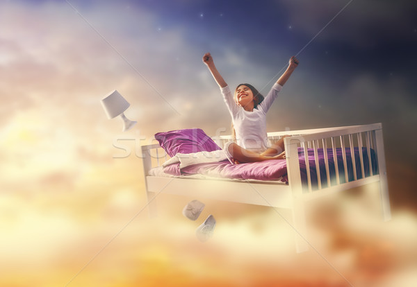 girl is flying in her bed Stock photo © choreograph