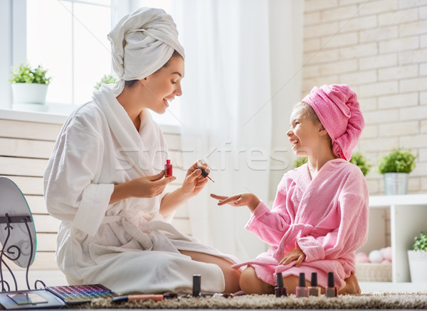 Mother and daughter are doing manicures Stock photo © choreograph