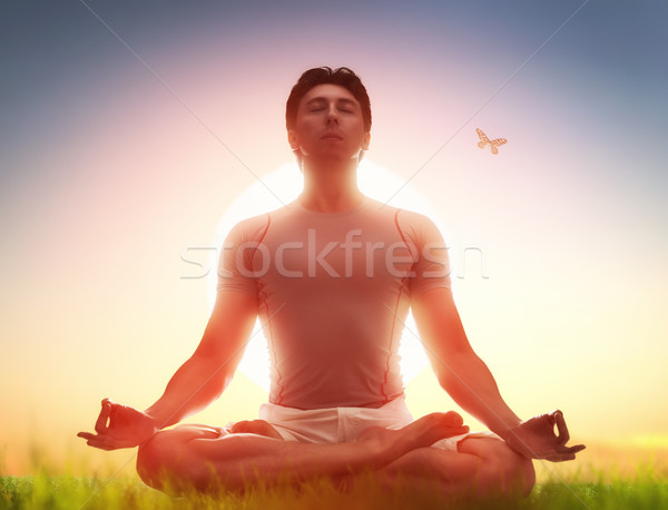 man enjoying meditation and yoga Stock photo © choreograph