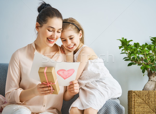Stock photo: daughter is congratulating mom