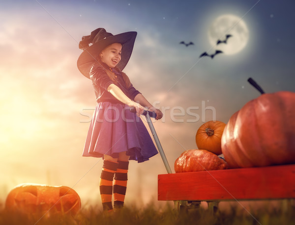 Stock photo: witch with pumpkins