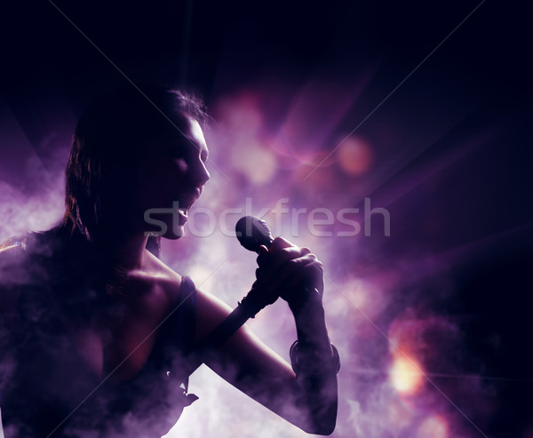 Silueta mujer luces mujeres luz micrófono Foto stock © choreograph