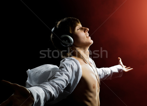 Uomo cuffie buio musica tecnologia divertimento Foto d'archivio © choreograph