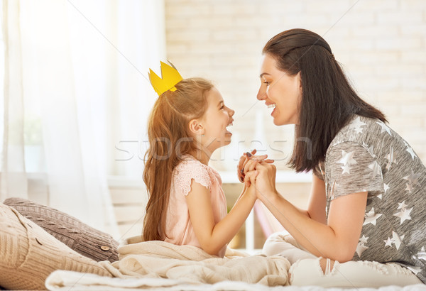 Stock photo: Mother and daughter playing and hugging